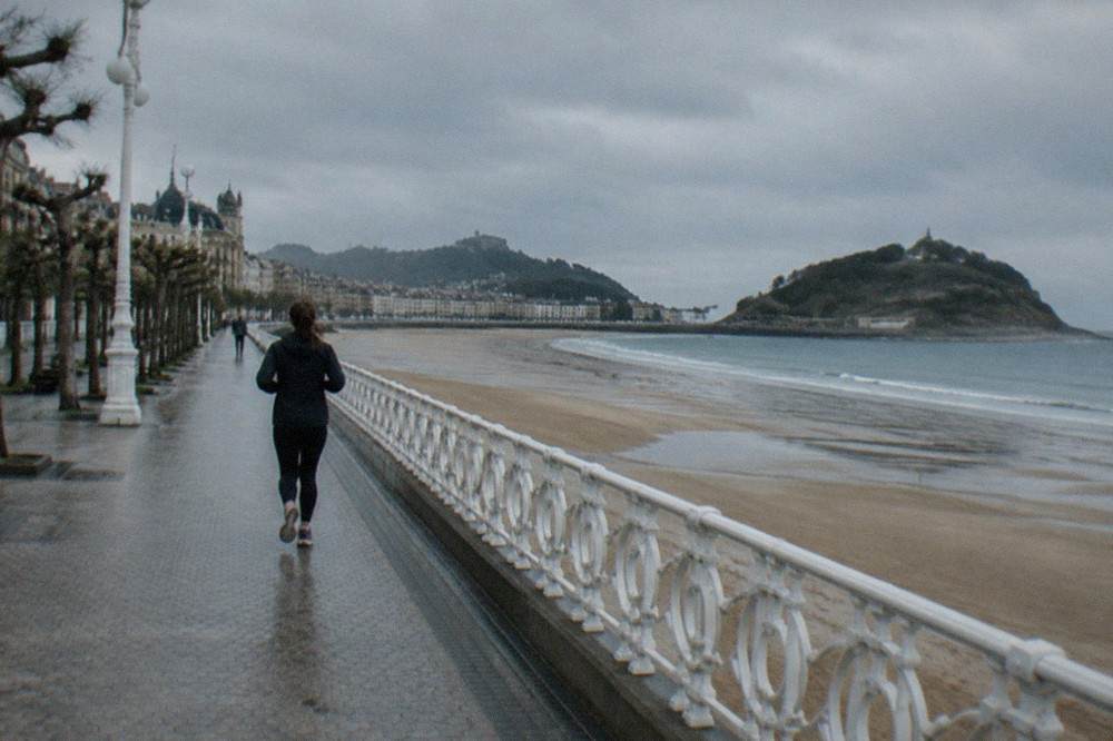 The La Concha bayfront promenade at low tide with the sandy beach and island in view