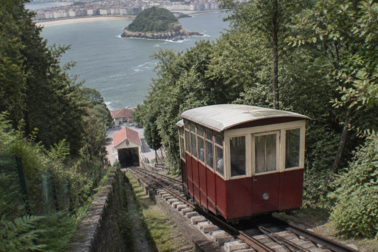 The wooden funicular car climbing the forested slope of Monte Igueldo above San Sebastián