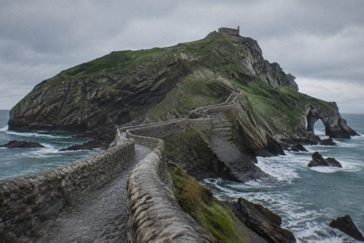 The rocky islet of Gaztelugatxe connected to the Basque coast by a stone footbridge