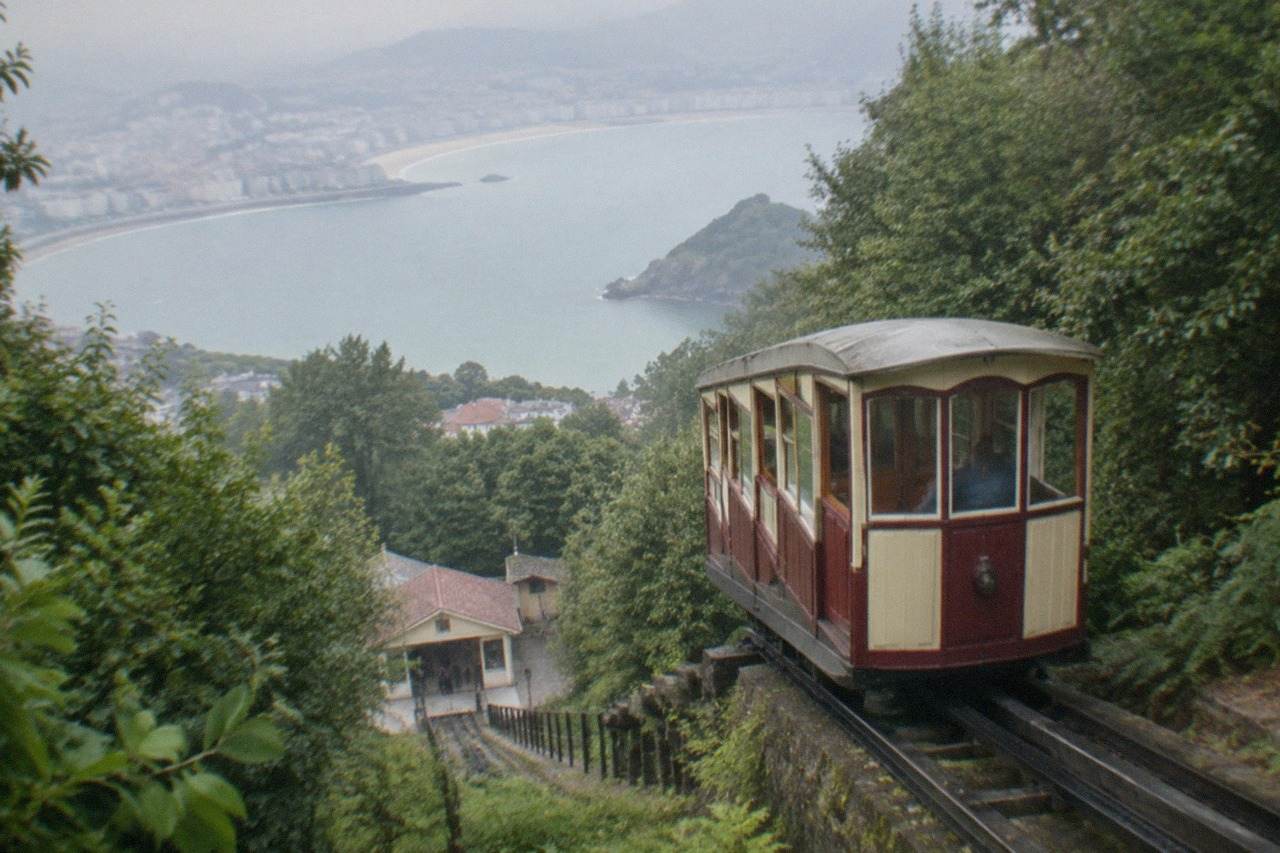 The wooden funicular car climbing the wooded slope of Monte Igueldo above the bay of San Sebastián