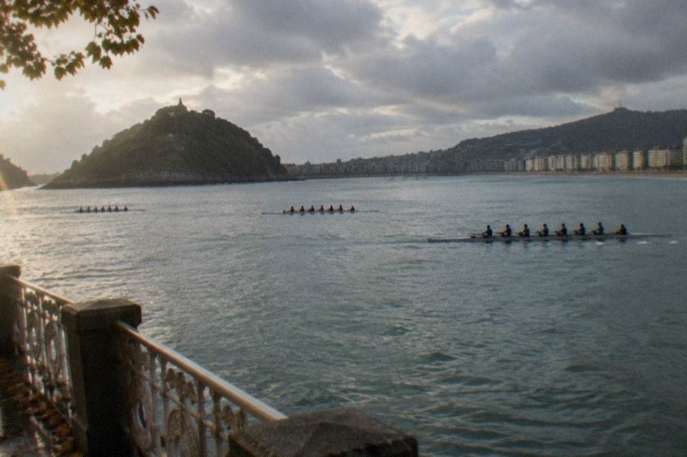 Rowing boats racing across La Concha bay in San Sebastián on a September morning
