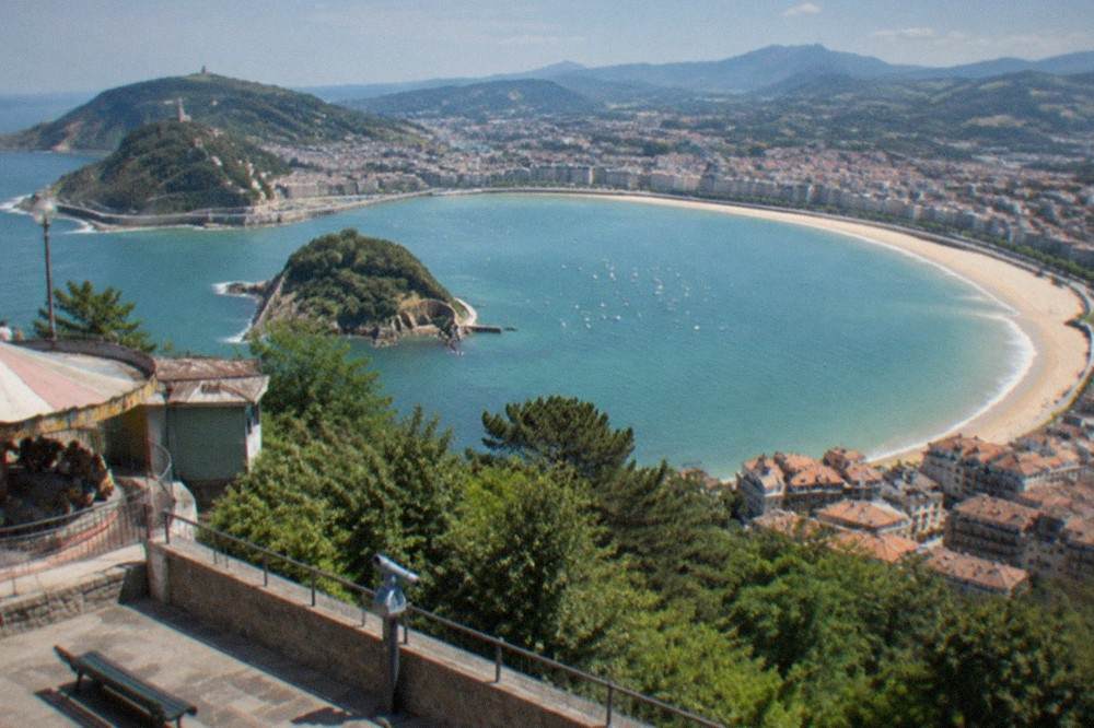 View over La Concha bay and the city rooftops from the Monte Igueldo viewpoint terrace
