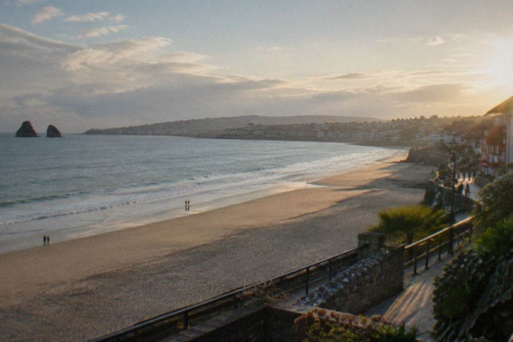 The beach and riverfront promenade at Hondarribia with views across to Hendaye in France