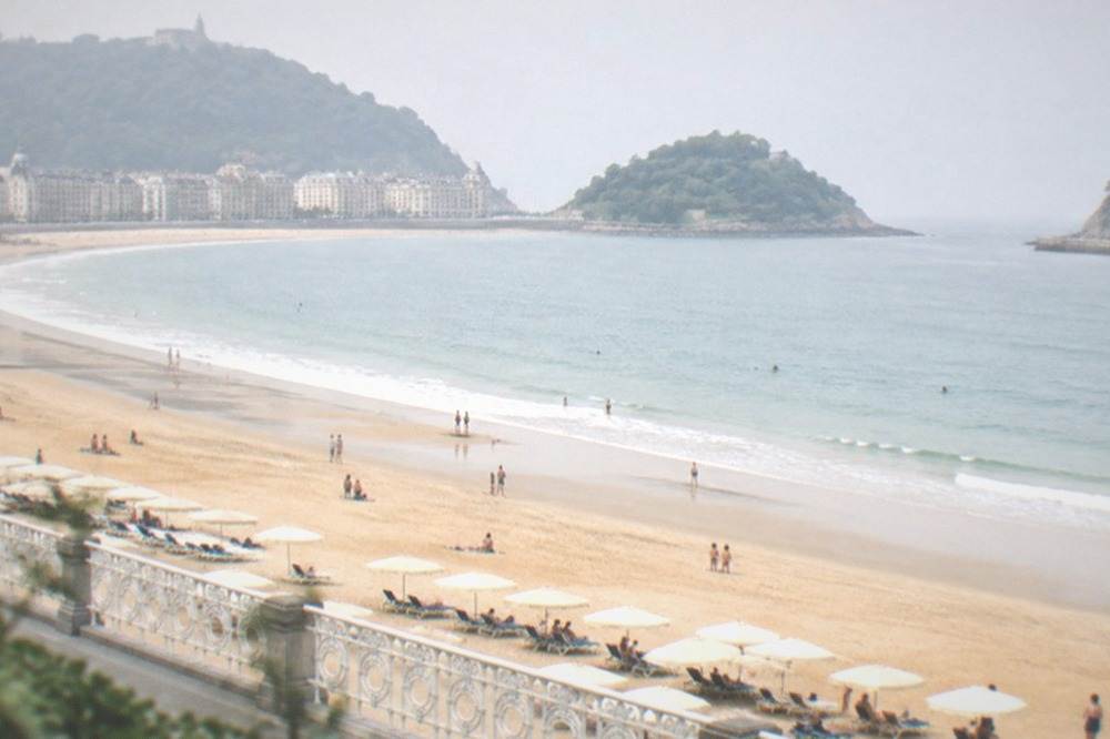 Parasols and loungers for hire on La Concha beach in San Sebastián