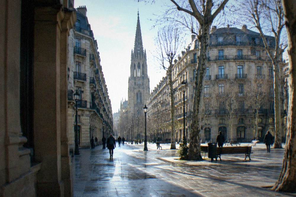 Wide 19th-century street in Centro San Sebastián with the Buen Pastor cathedral tower at the end of the view