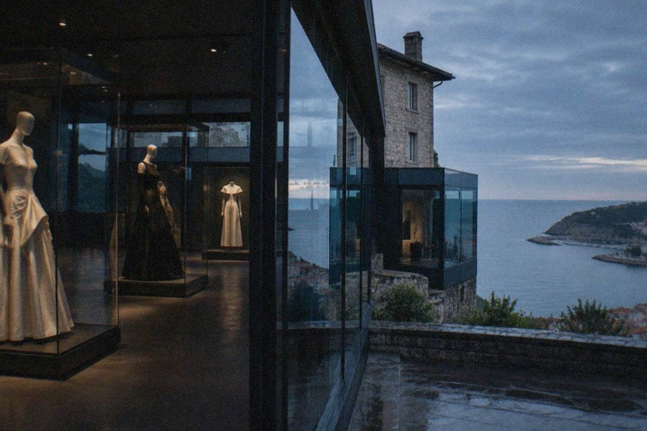 The glass and stone facade of the Cristobal Balenciaga museum beside the old town of Getaria