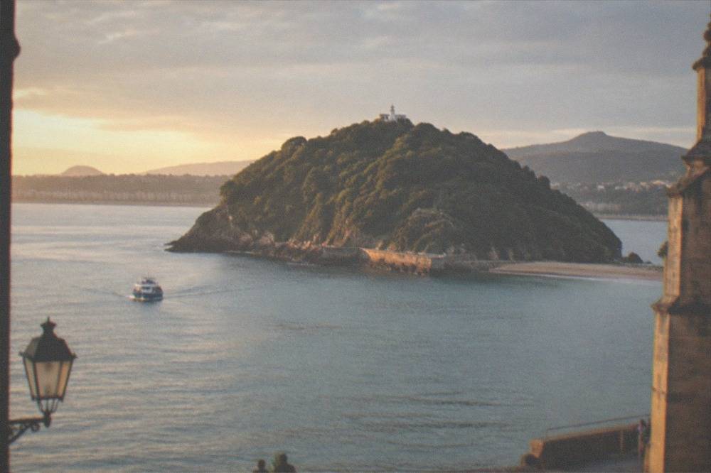 Harbour wall and Santa Clara Island seen from the Old Town near the basilica in San Sebastián