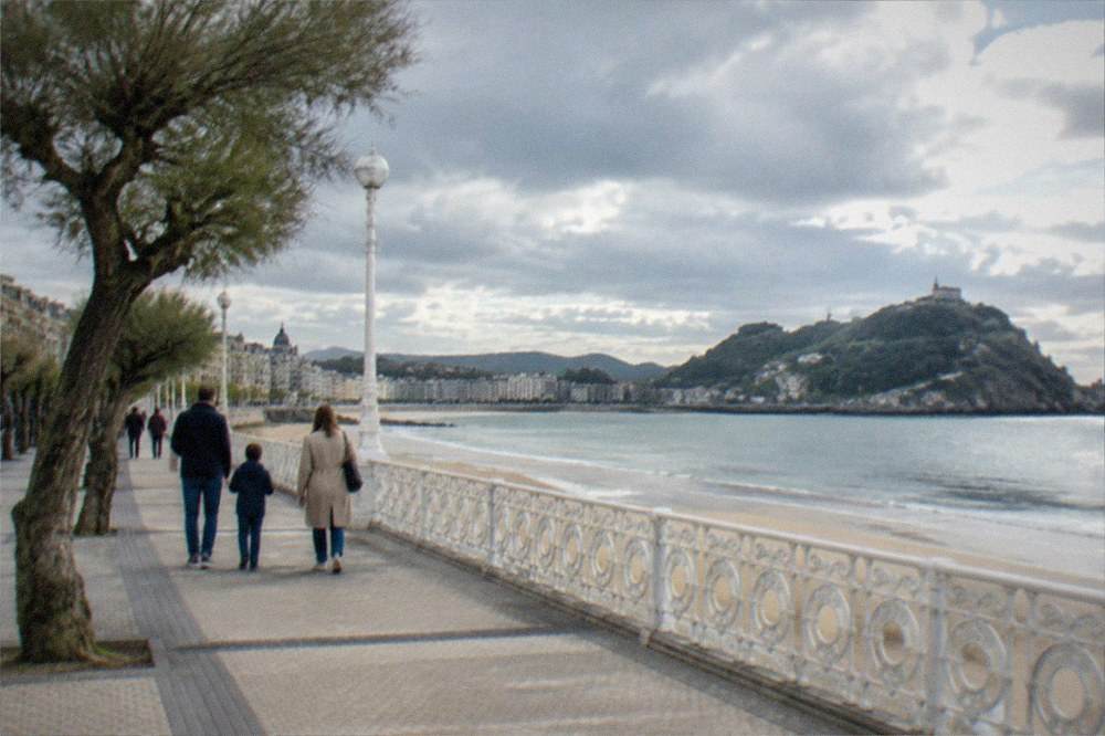 A family walking along a seafront promenade after a museum visit