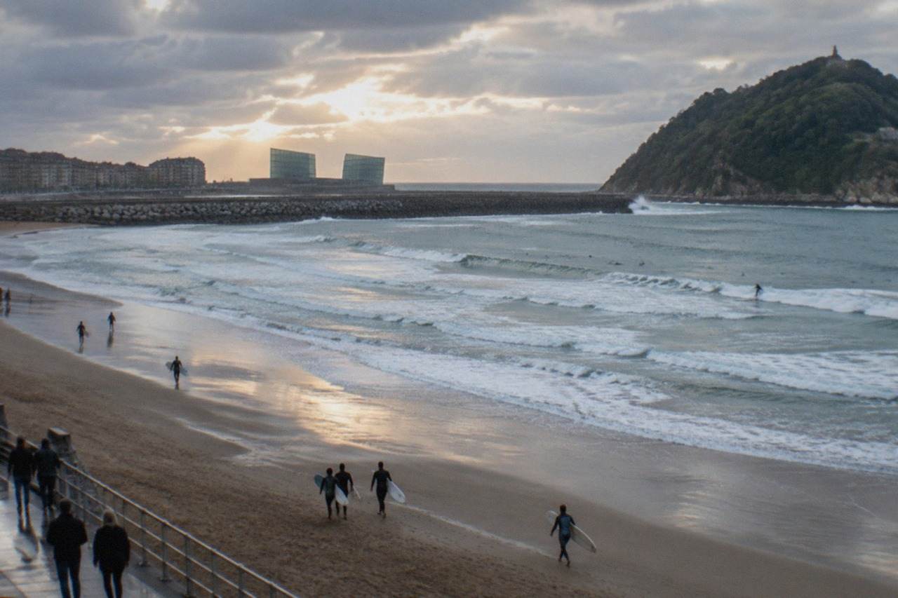 The twin glass cubes of the Kursaal Congress Centre standing beside the Zurriola beach in San Sebastián at dusk