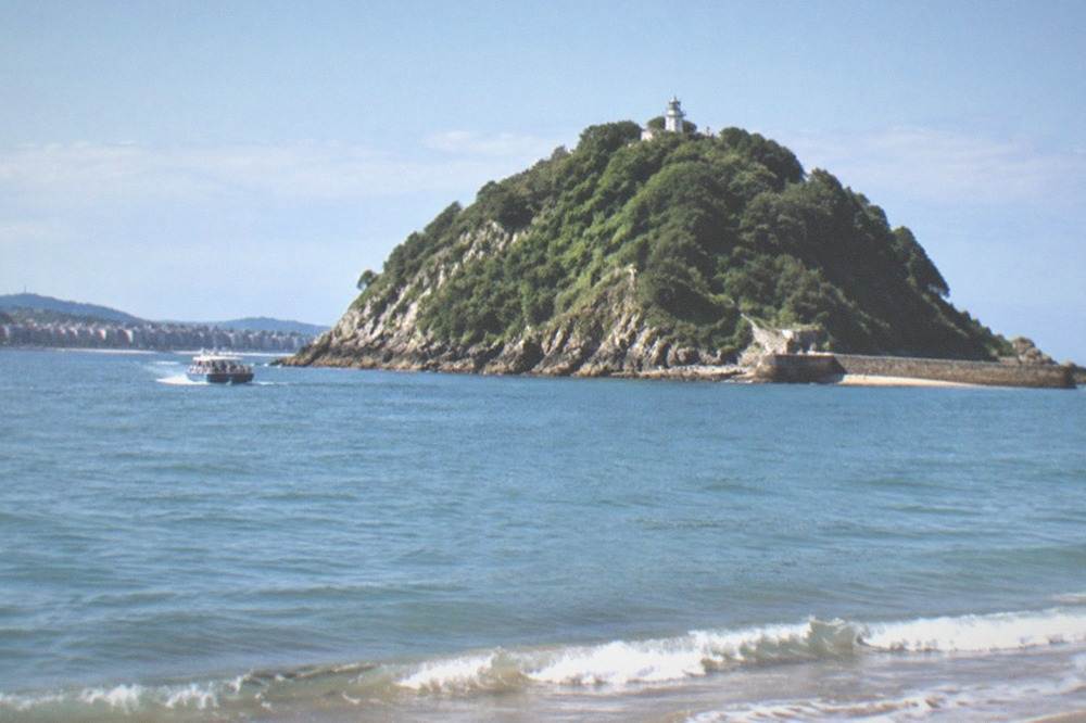 Santa Clara island seen across the water from La Concha beach