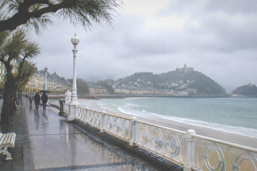 Clouds over La Concha bay with the spa and promenade below