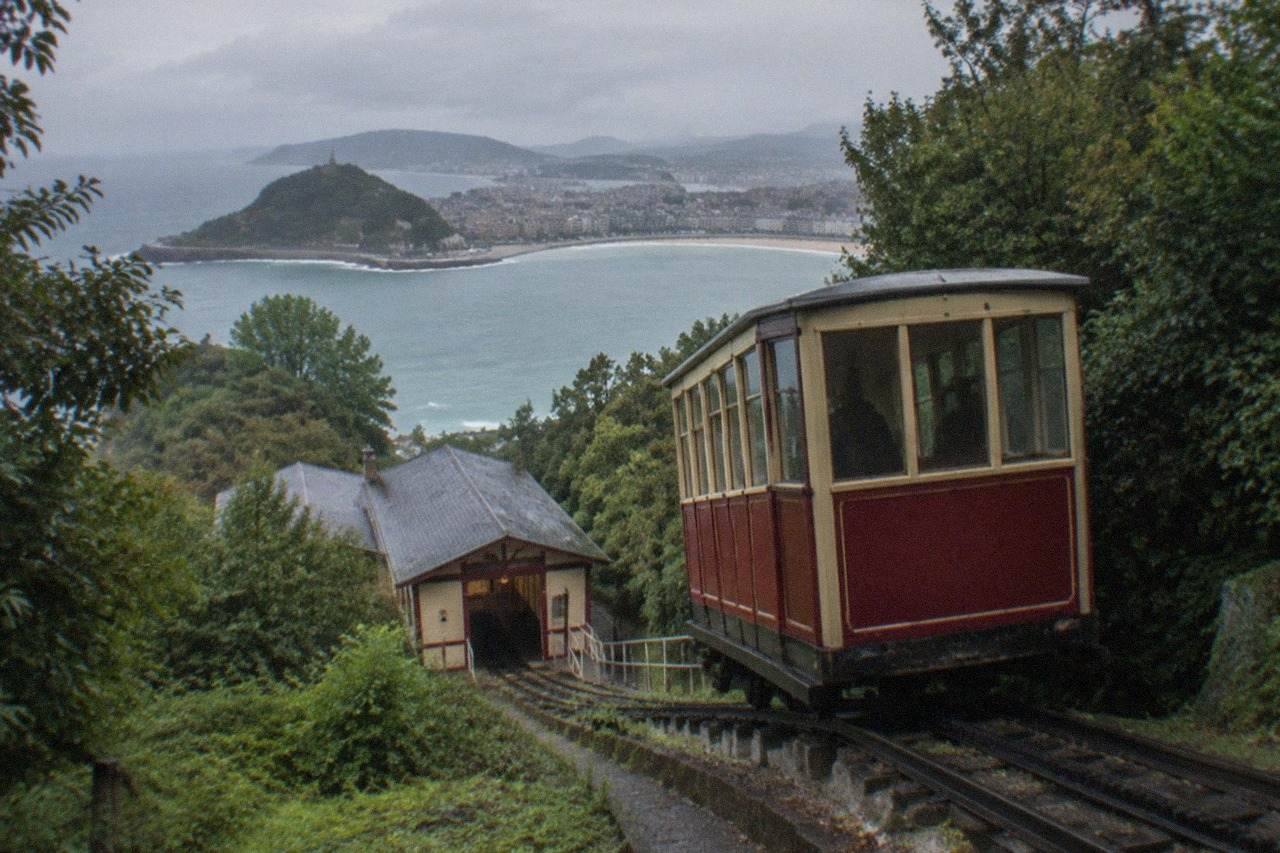 The wooden funicular car climbing the hillside above the bay of San Sebastián