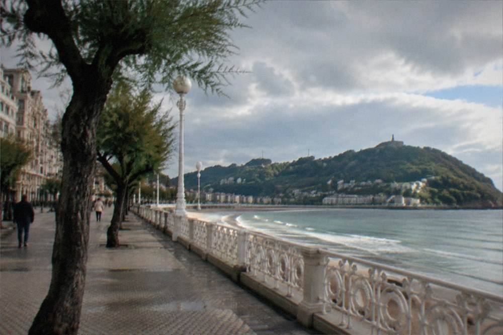 The promenade along Ondarreta beach leading toward the foot of the hill