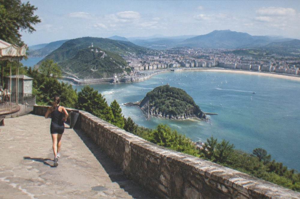 The hilltop terrace in the late afternoon with the bay stretching east