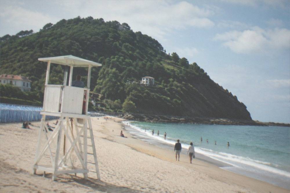 A lifeguard watchtower on the sand at Ondarreta Beach in summer