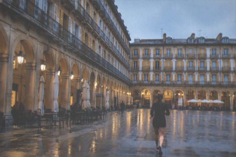Stone arcade columns and facades of the Plaza de la Constitucion in San Sebastián