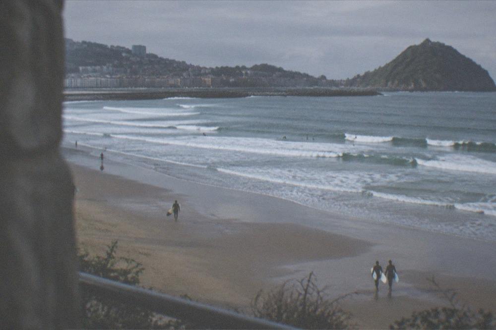 Three beaches of a bay seen from high ground on an overcast day