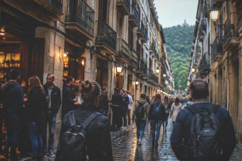 A guided group of visitors walking through a European old town street in the evening
