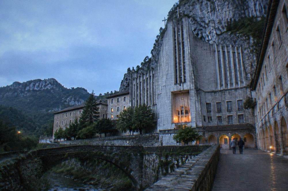 Modernist basilica facade of the sanctuary of Arantzazu against the cliff
