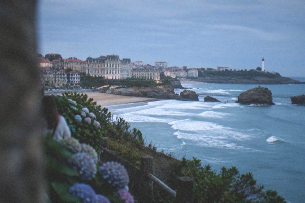 The seafront of Biarritz seen from a cliff path with the Atlantic in the background