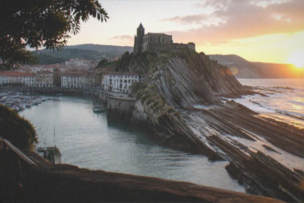 Layers of rock running into the sea at sunset on the Zumaia coast