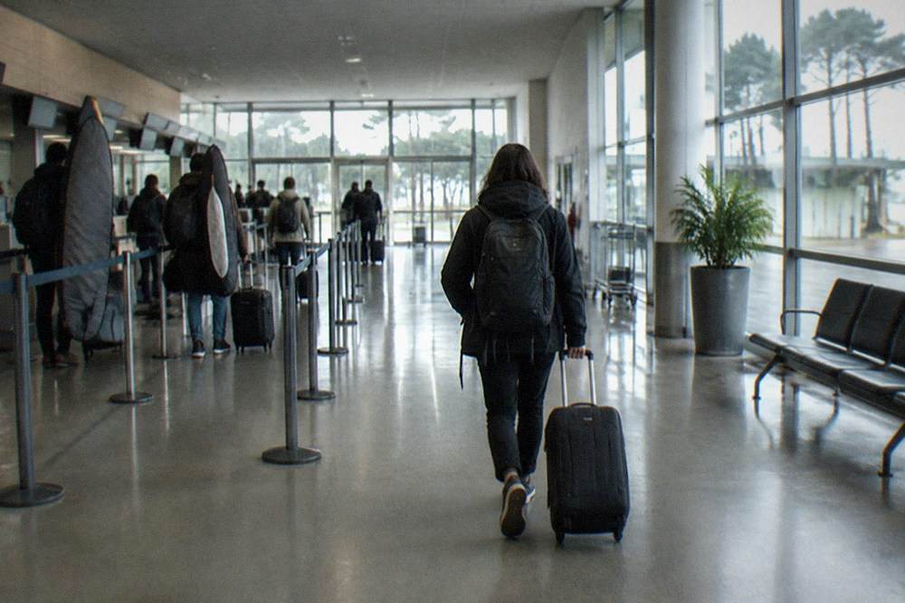 The check-in hall of a small French airport with departure boards