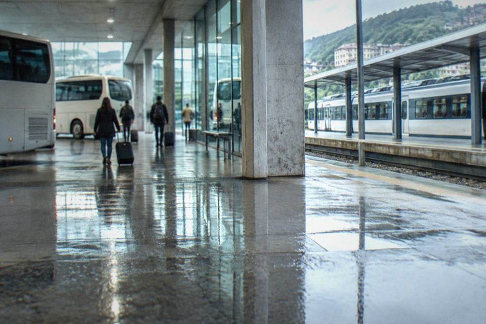 A regional train at a small station platform in the Basque Country