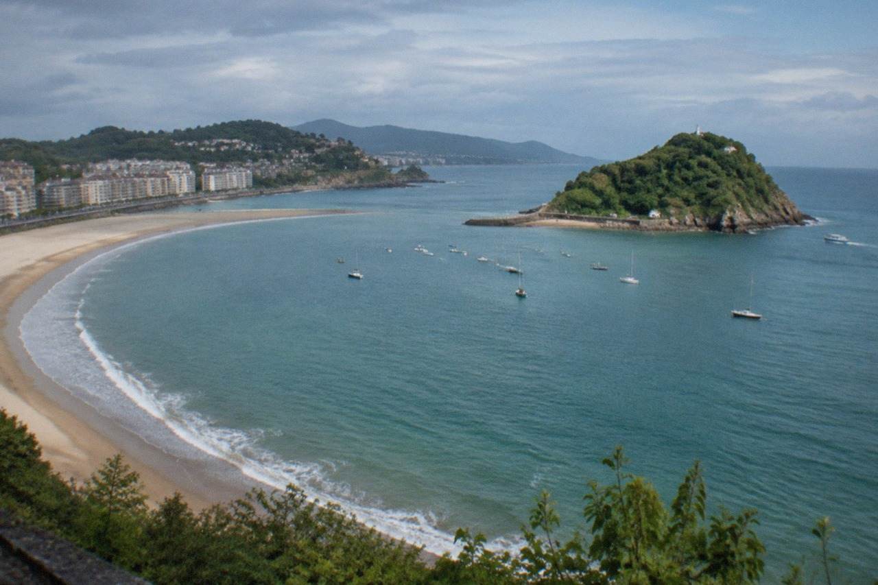 View over La Concha bay in San Sebastián with the beach curve and Santa Clara island in the distance