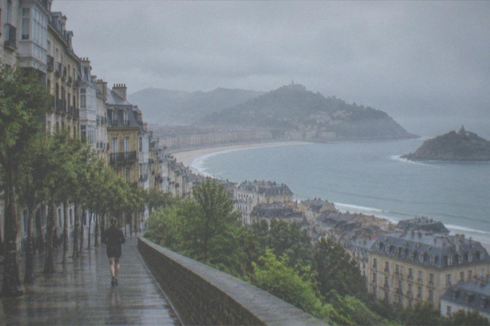 Rain clouds over the Bay of Biscay coastline seen from a hillside above San Sebastián