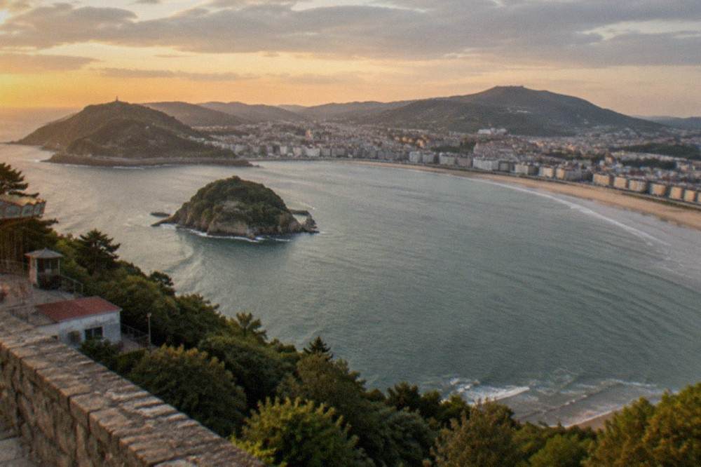 Ondarreta beach at low tide with Monte Igueldo rising behind it
