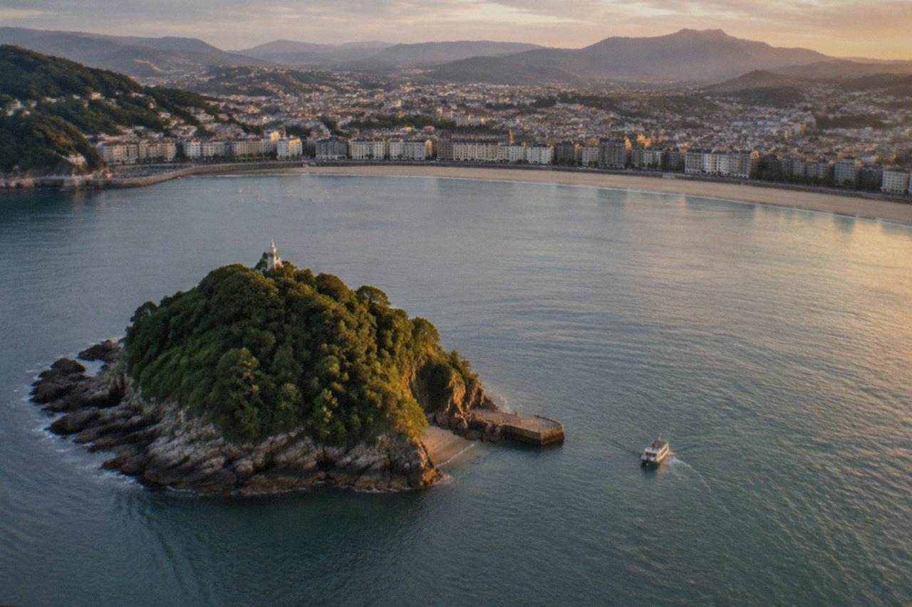 Aerial view of San Sebastián with La Concha bay and Santa Clara island in the evening light