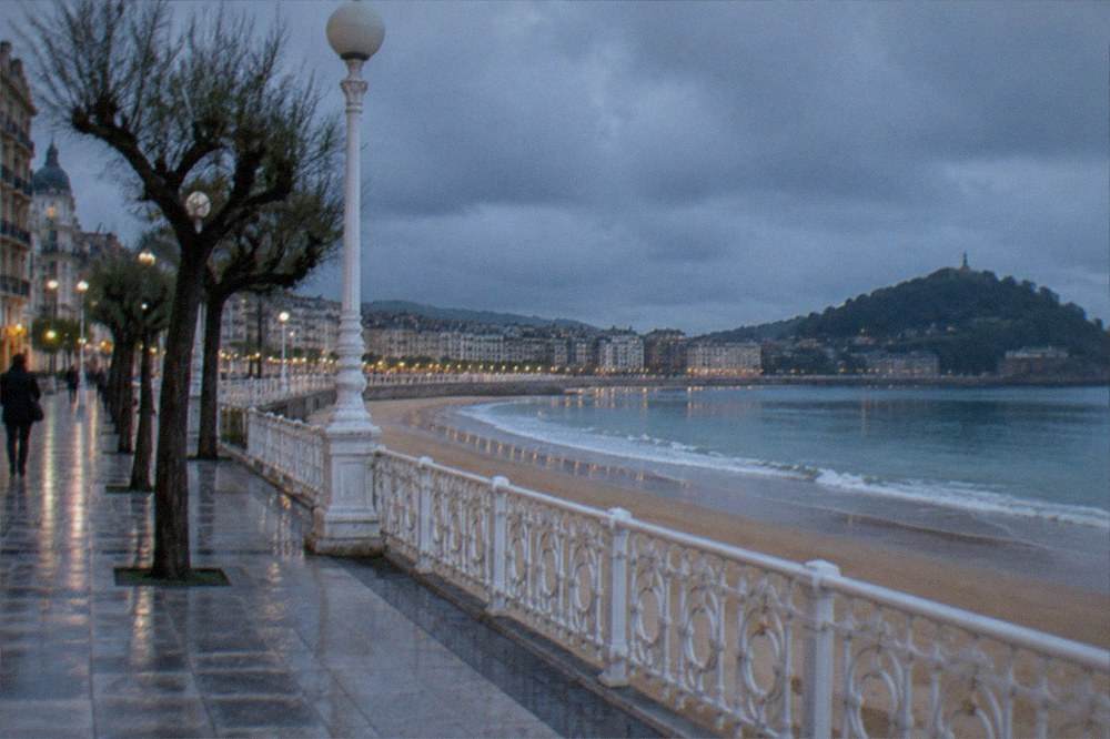 Rain clouds over La Concha bay with the beach promenade below