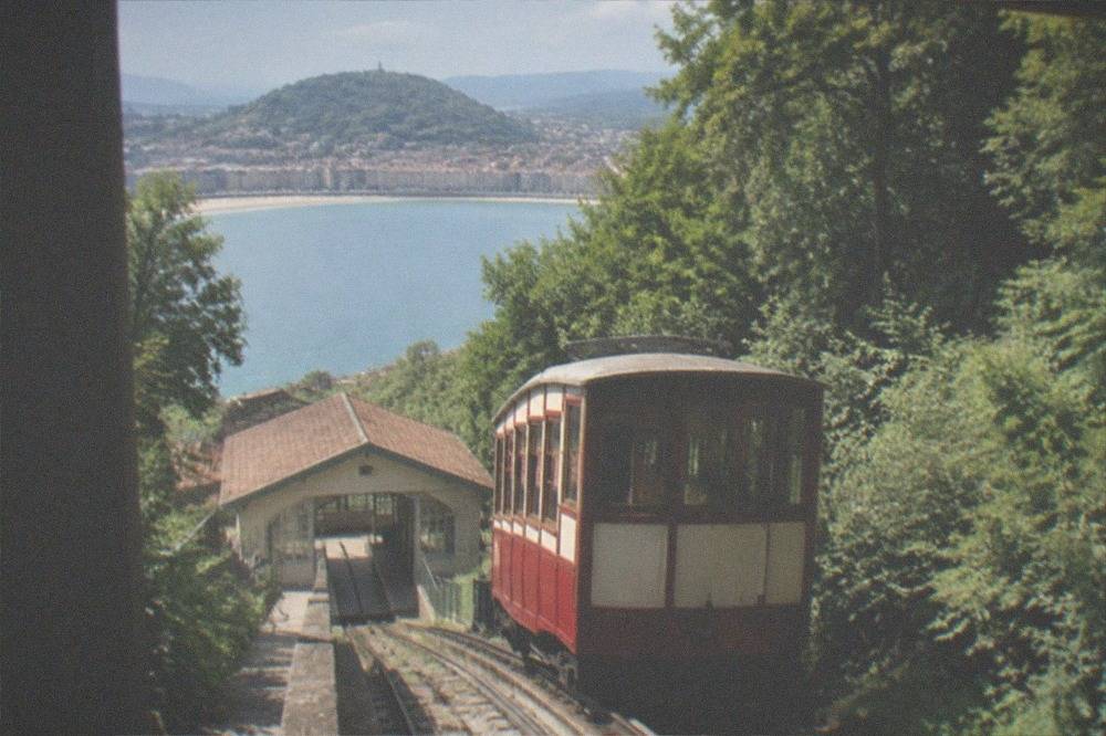 The yellow funicular car of Monte Igueldo at its lower station