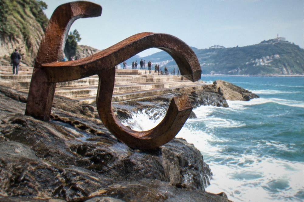 The steel sculptures of the Peine del Viento on the rocks at the western end of Ondarreta beach