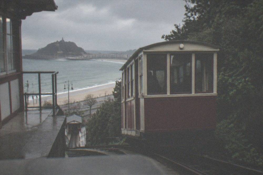 Wooden funicular car of Monte Igueldo at its lower station beside the beach promenade