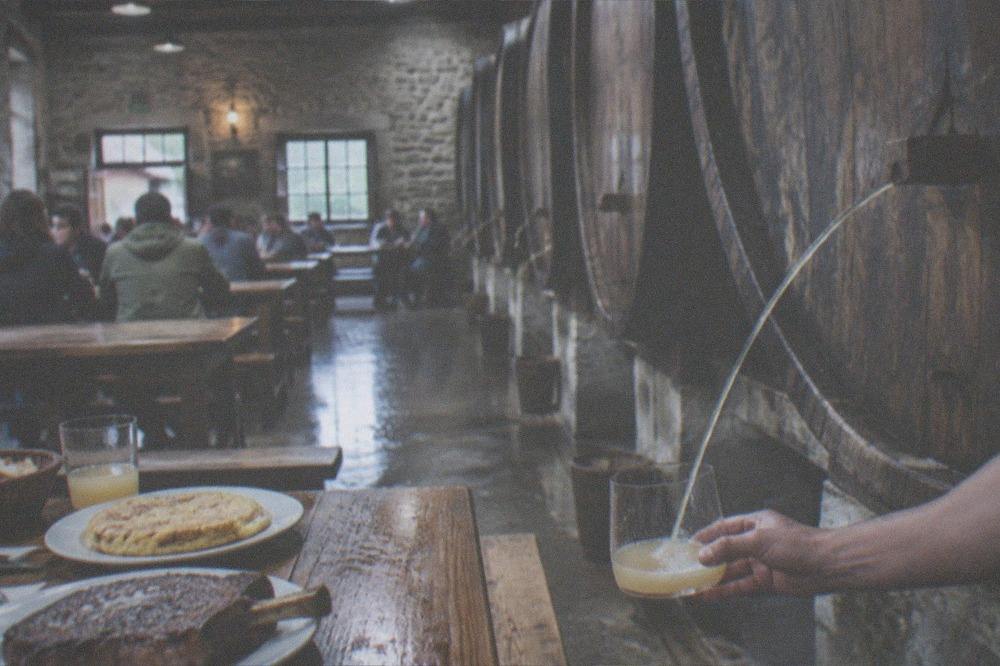A chalkboard outside a cider house near San Sebastián listing dishes in Basque