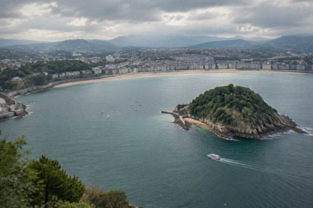 Aerial view of La Concha bay and Santa Clara island on an overcast morning