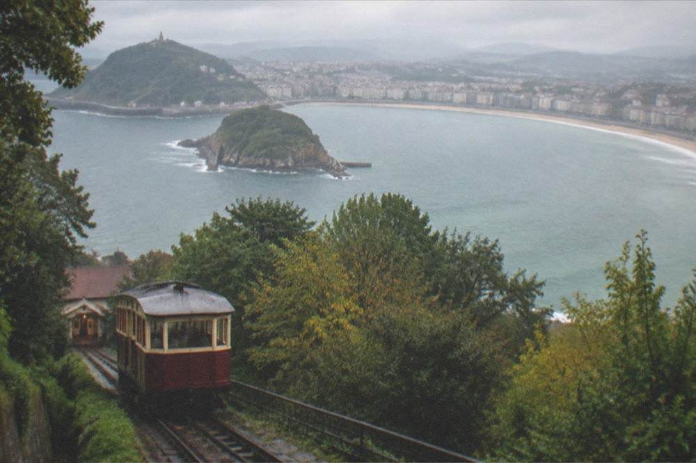 View over La Concha bay from Monte Igueldo with the funicular rails in the foreground