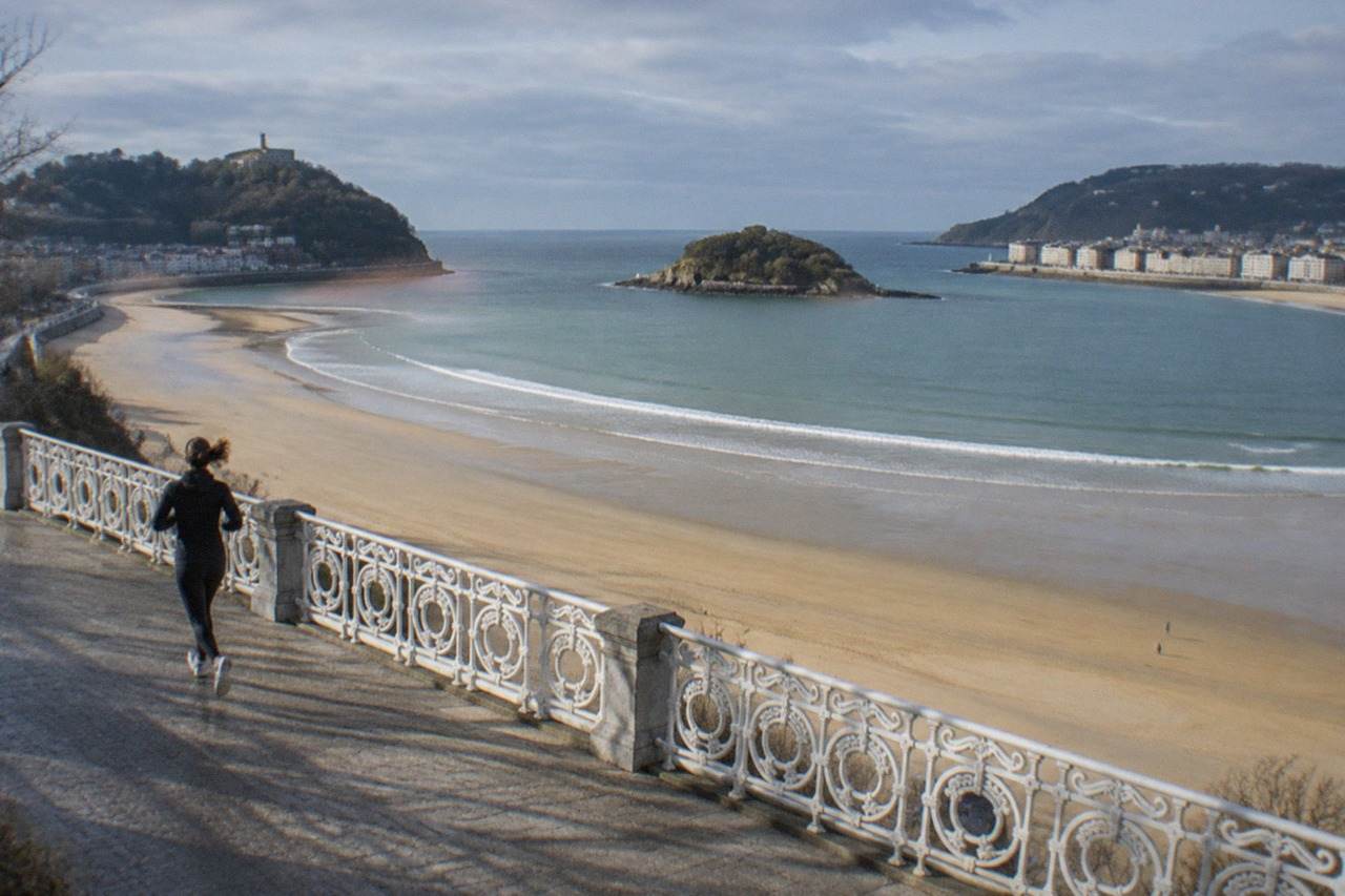 The crescent of La Concha beach in San Sebastián seen from above with the bay and Santa Clara island