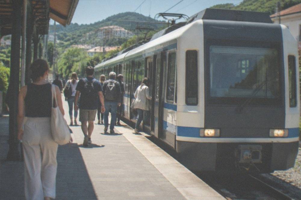 A narrow-gauge Euskotren train at a small Basque station platform