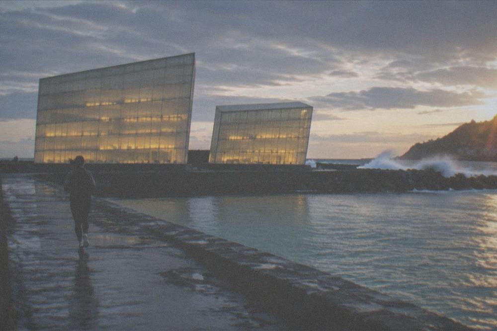 The illuminated Kursaal concert hall cubes beside the river mouth in San Sebastián at night