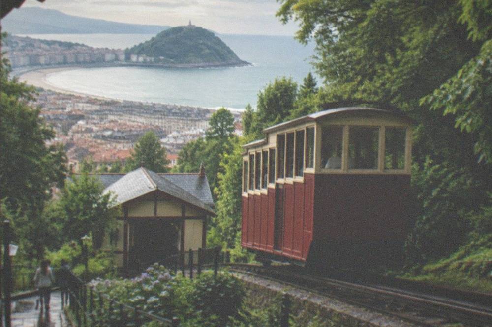 The wooden funicular car climbing Monte Igueldo above the rooftops of San Sebastián