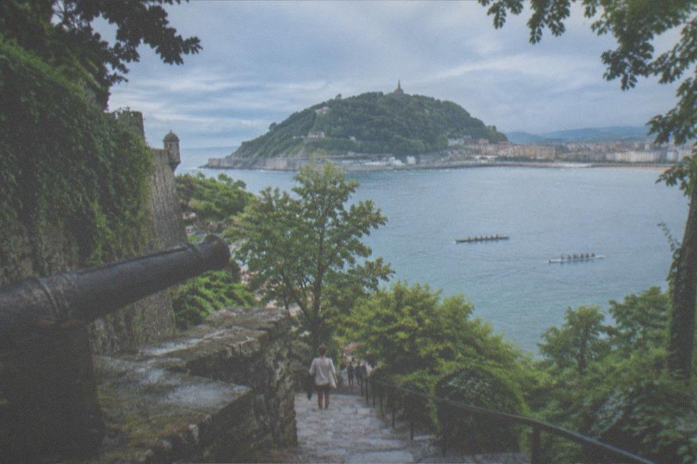 Rowing trainers on La Concha bay in San Sebastián with Urgull hill in the background