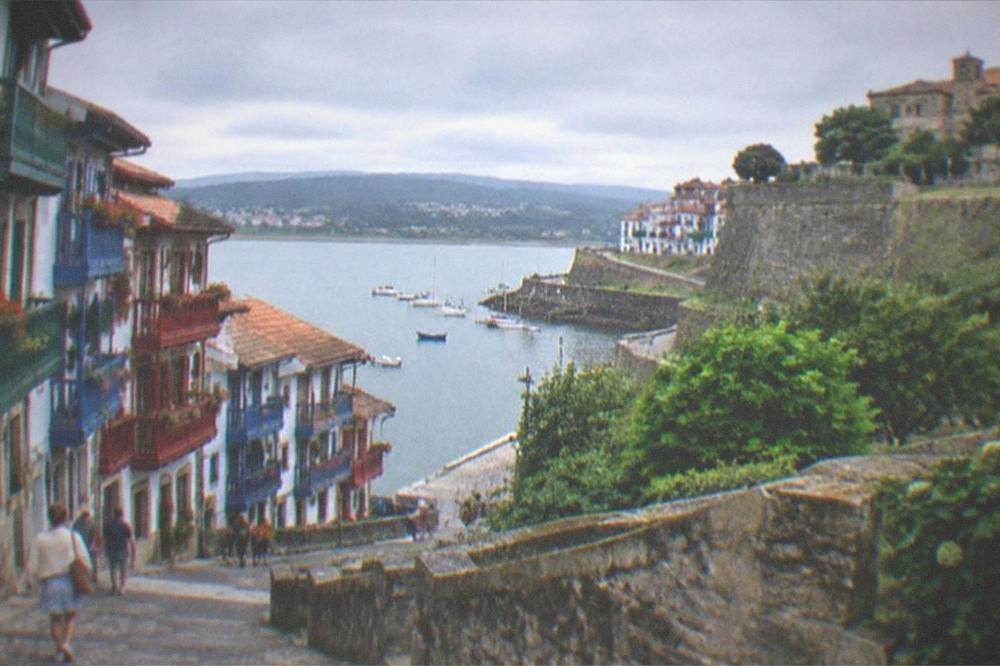 The walled old quarter of Hondarribia near San Sebastián with colourful wooden balconies under a summer sky
