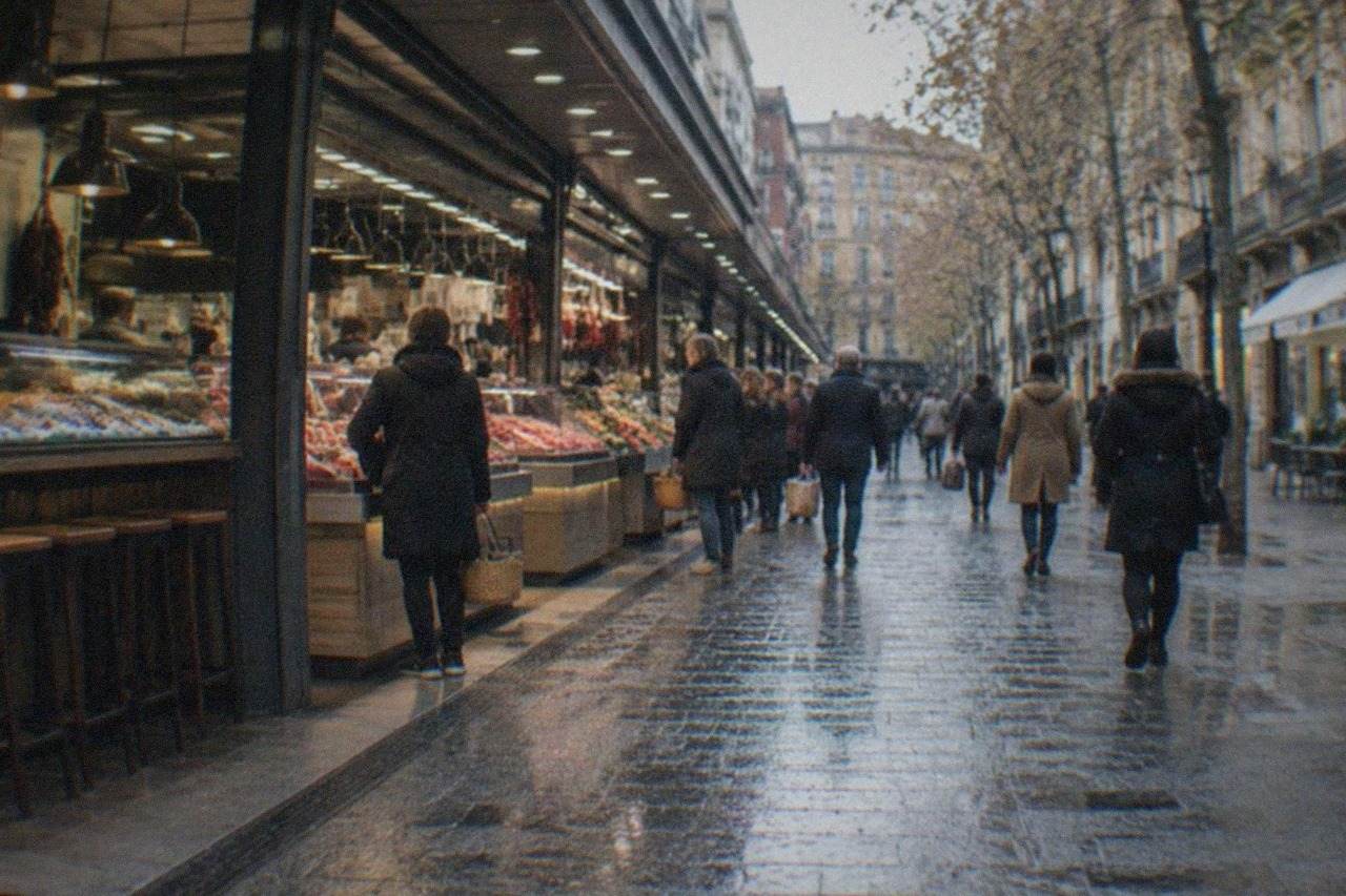 Shoppers walking along a tree-lined shopping street with awnings and storefronts in a European city centre