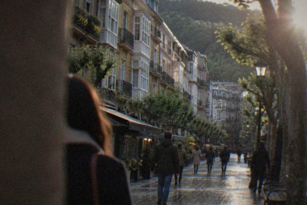 A pedestrian street in the old town of San Sebastián with bars and balconied buildings