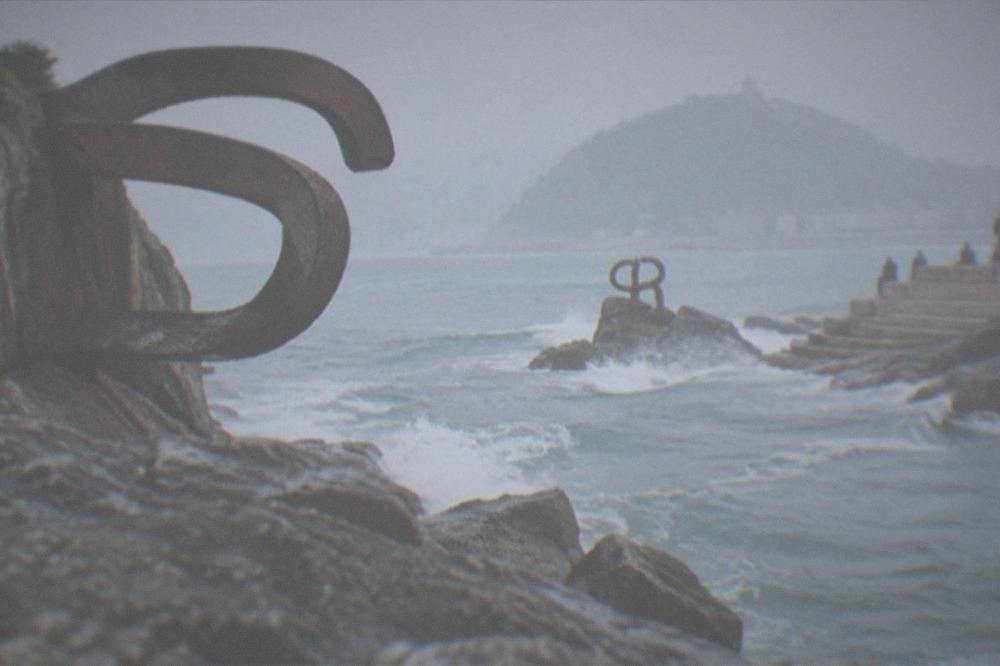 The steel sculptures of the Peine del Viento on the rocks at the western end of the bay