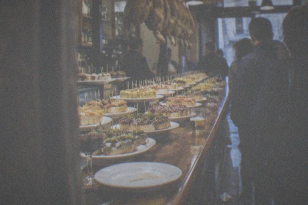 Wooden skewers on an empty plate after eating pintxos