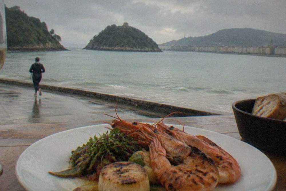 A plated seafood dish in a San Sebastián restaurant near La Concha bay