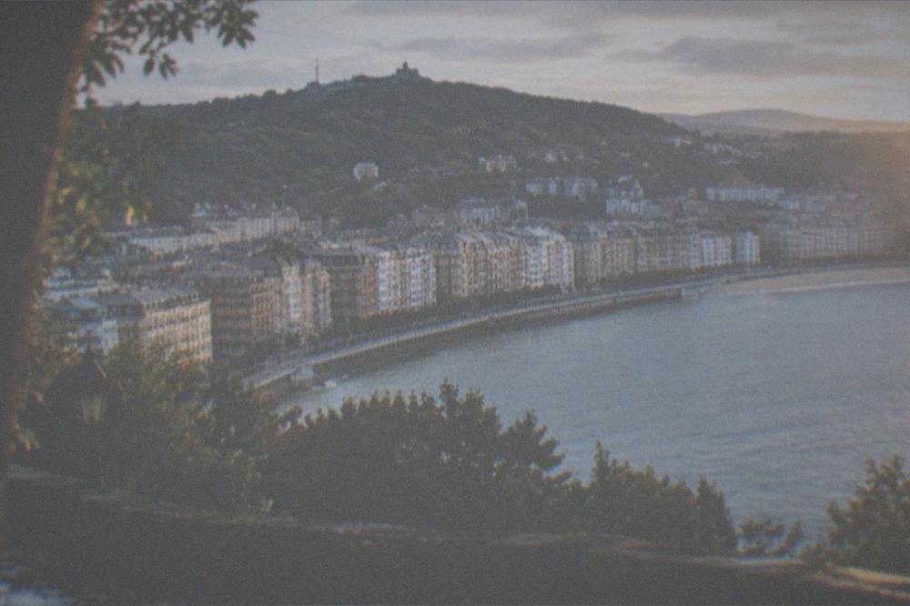 Evening light on the buildings and bay of San Sebastián seen from Monte Urgull